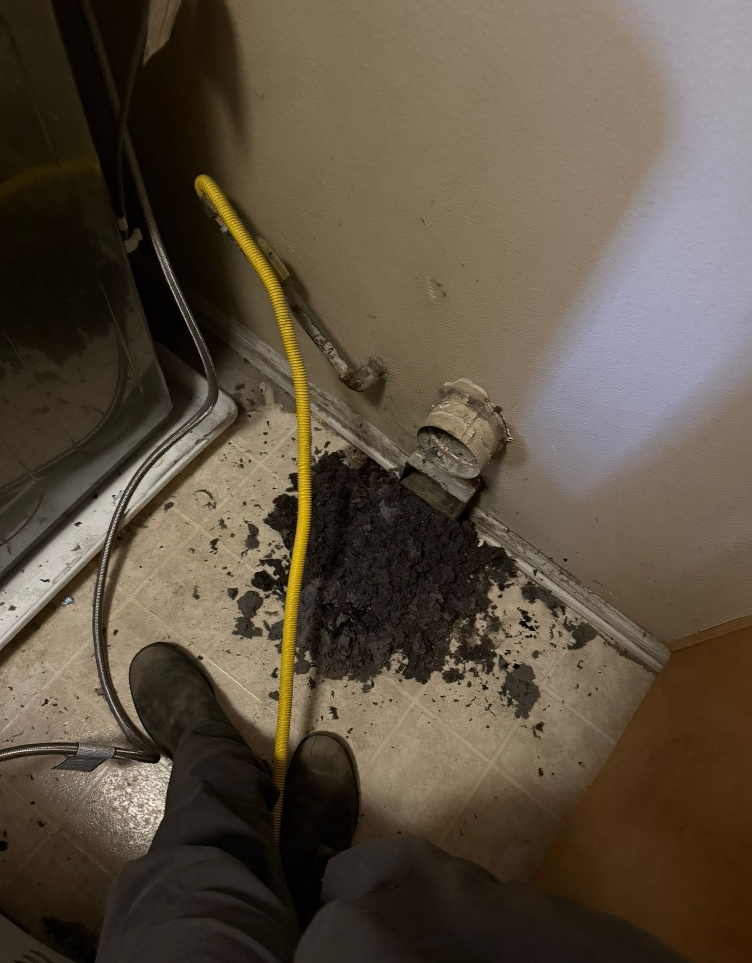 Dryer vent clogged with lint debris during professional dryer vent cleaning service in Indiana home