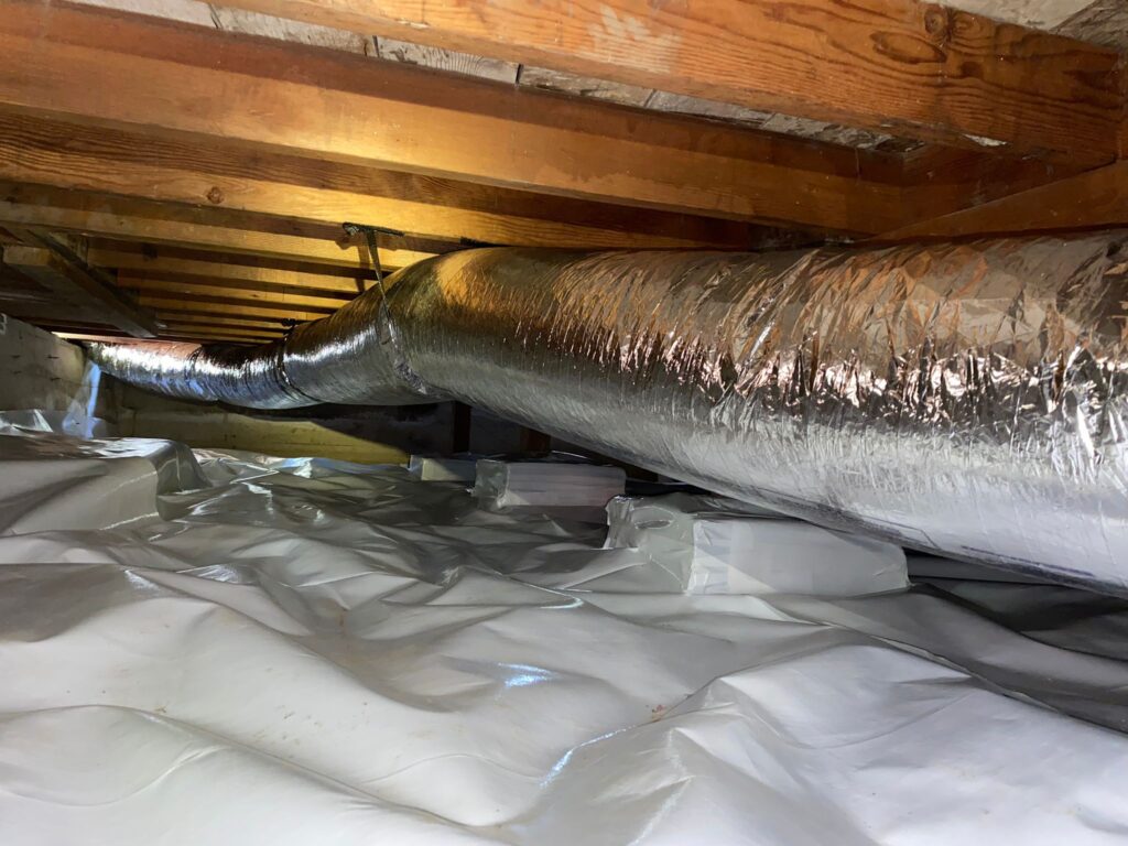 Air duct installation in a crawl space improving airflow and HVAC efficiency in an Indiana home
